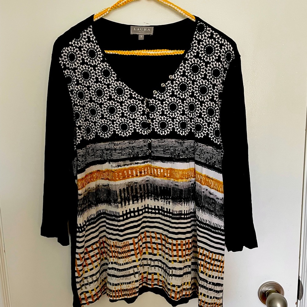 Long sleeve shirt with unique details. Laura X.